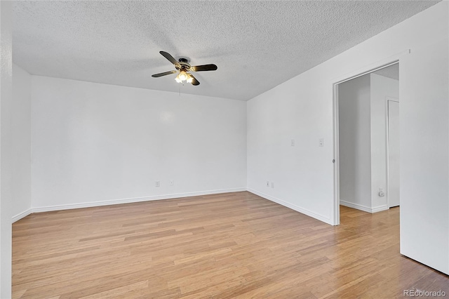 spare room featuring ceiling fan, a textured ceiling, and light hardwood / wood-style floors