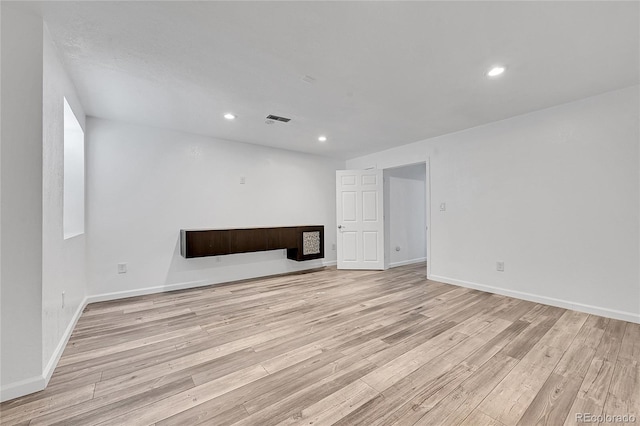 unfurnished living room featuring light hardwood / wood-style flooring