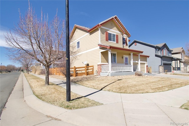 view of front of house with a garage and covered porch