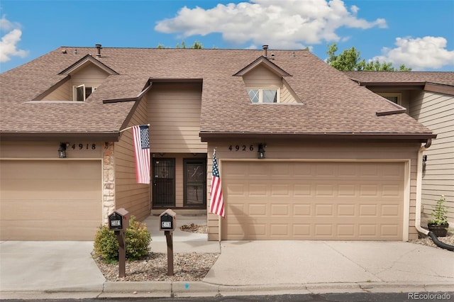 multi unit property featuring a garage