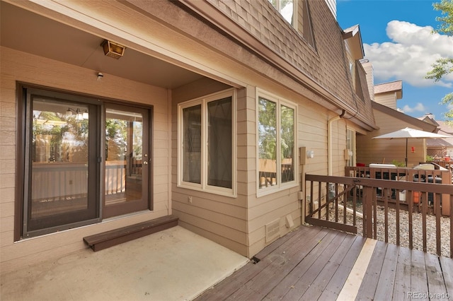 property entrance with a wooden deck