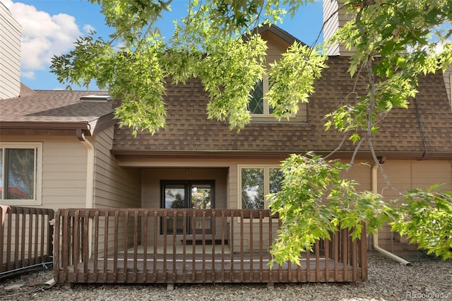 back of house featuring a wooden deck