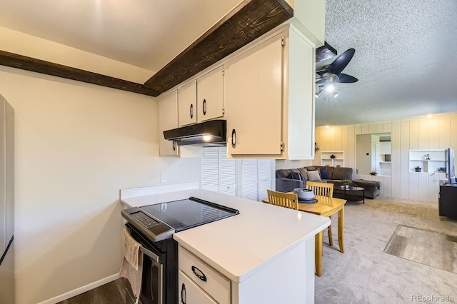 kitchen with white cabinetry, a textured ceiling, electric range, a ceiling fan, and under cabinet range hood