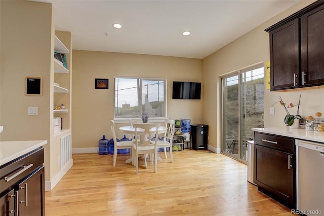 dining room with light wood-type flooring and plenty of natural light