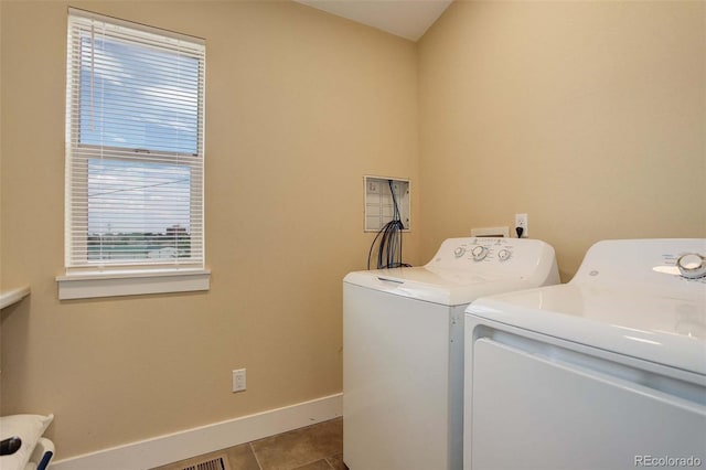 washroom featuring light tile patterned floors and washer and dryer