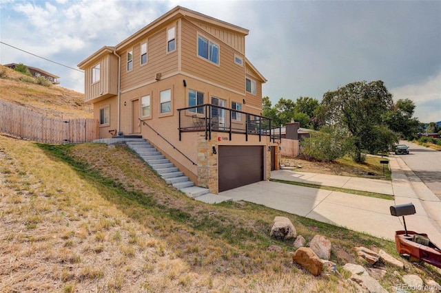 view of side of property featuring a garage