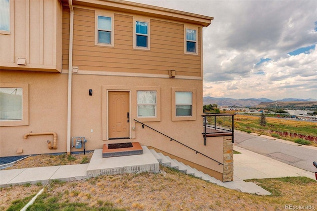 view of front of property with a mountain view