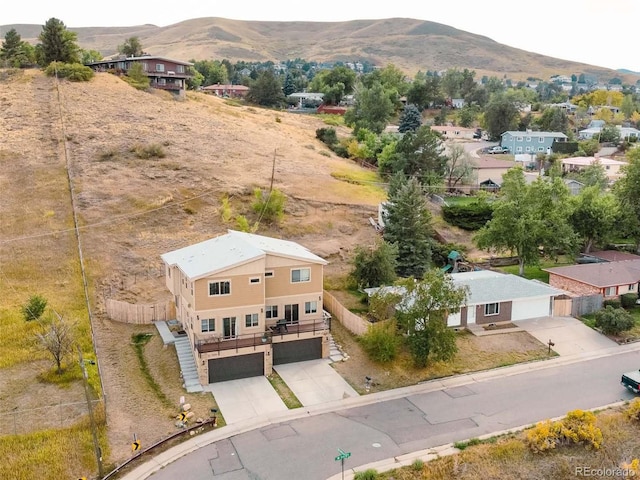 birds eye view of property featuring a mountain view