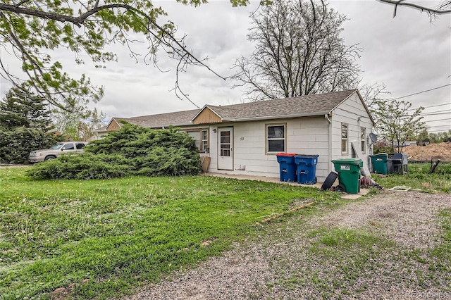 back of property with a yard