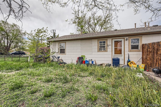 rear view of property featuring central AC