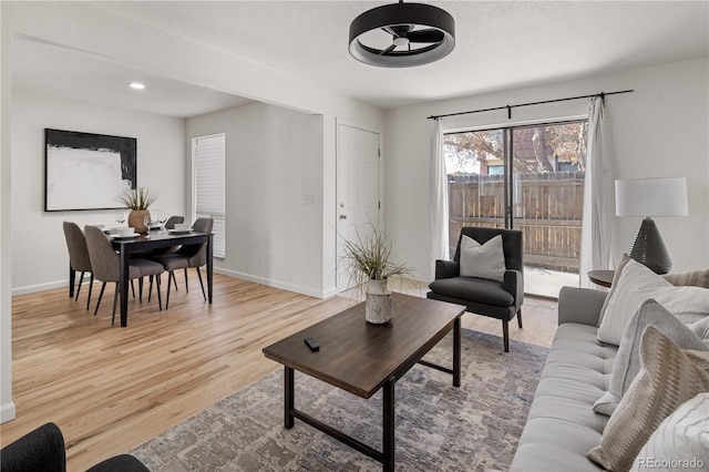 9338 W Utah Pl, Lakewood, CO 80232 - living area with light wood finished floors, baseboards, and recessed lighting