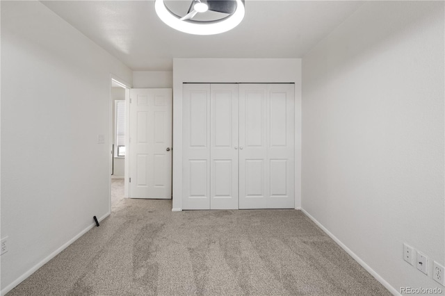 9338 W Utah Pl, Lakewood, CO 80232 - unfurnished bedroom featuring carpet floors, baseboards, and a closet