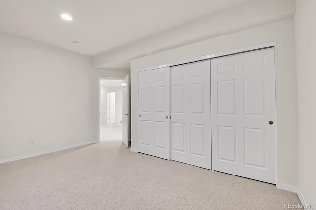 unfurnished bedroom featuring recessed lighting, a closet, and baseboards