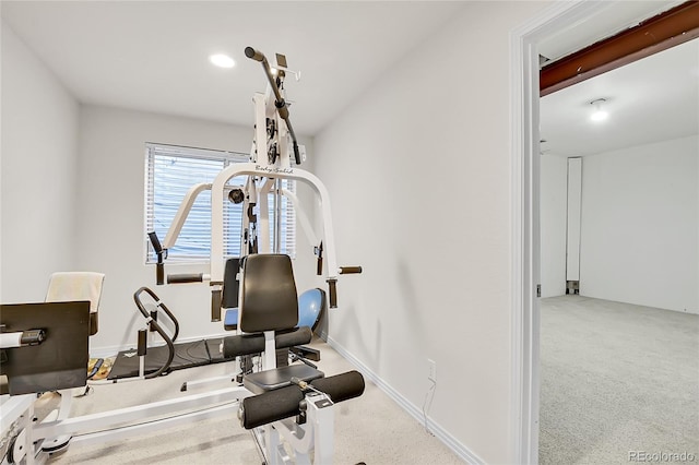 exercise area with carpet floors and baseboards