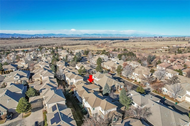 bird's eye view with a residential view and a mountain view