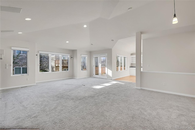 unfurnished living room featuring light colored carpet