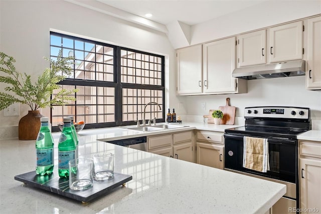 kitchen featuring light stone counters, a sink, appliances with stainless steel finishes, under cabinet range hood, and recessed lighting