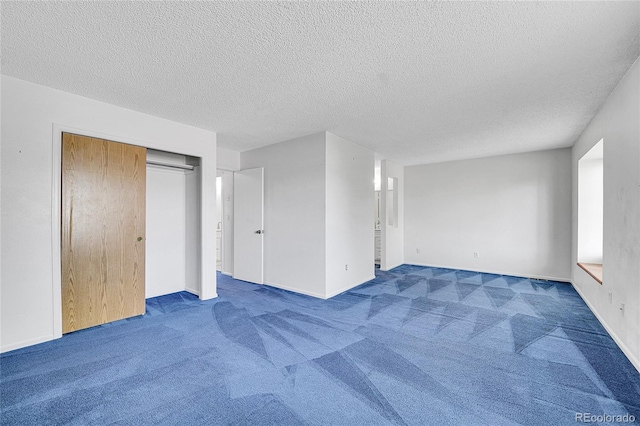 10143 Quivas St, Thornton, CO 80260 - unfurnished bedroom featuring carpet floors, a textured ceiling, and a closet