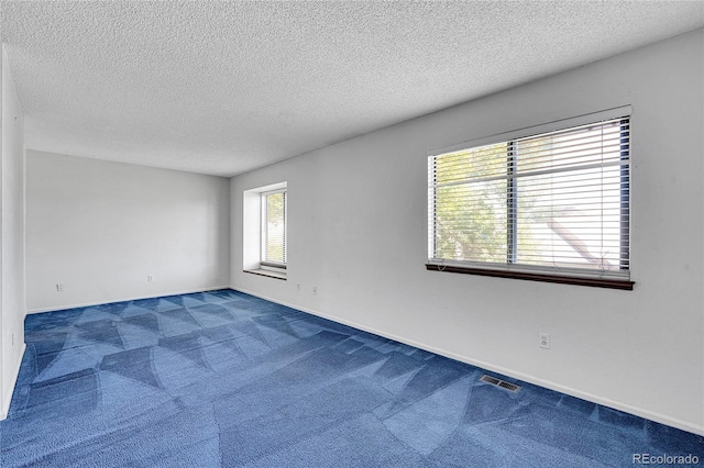 10143 Quivas St, Thornton, CO 80260 - carpeted spare room featuring a textured ceiling and baseboards