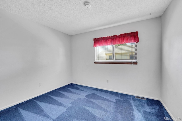 10143 Quivas St, Thornton, CO 80260 - spare room featuring carpet, a smoke detector, and a textured ceiling