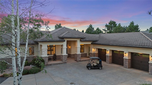 view of front of property with a garage