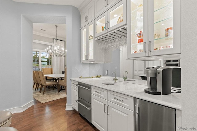 bar with stainless steel refrigerator, white cabinetry, sink, dark hardwood / wood-style flooring, and light stone countertops