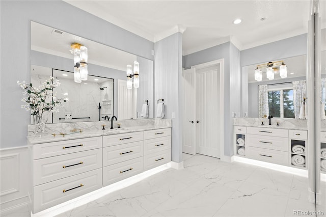 bathroom featuring crown molding, vanity, and a shower