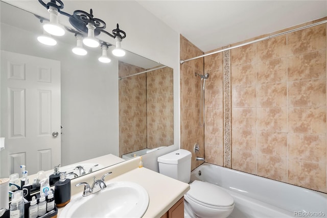 full bathroom with vanity, toilet, and tiled shower / bath combo