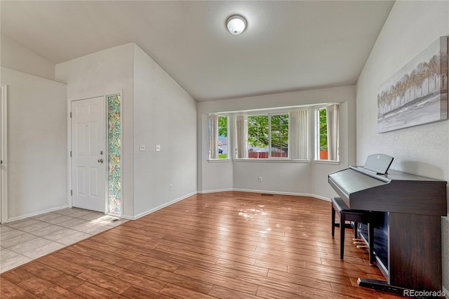 5350 S Quail Way, Littleton, CO 80127 - foyer featuring lofted ceiling, hardwood / wood-style flooring, and baseboards
