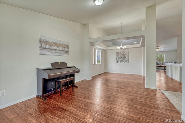 5350 S Quail Way, Littleton, CO 80127 - foyer featuring plenty of natural light, a chandelier, wood finished floors, and baseboards