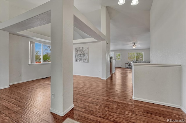5350 S Quail Way, Littleton, CO 80127 - unfurnished living room with wood finished floors, baseboards, and a ceiling fan