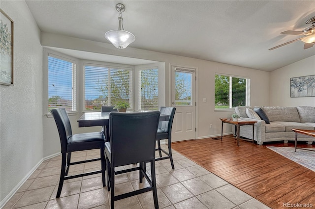 5350 S Quail Way, Littleton, CO 80127 - dining room featuring ceiling fan, a textured wall, lofted ceiling, baseboards, and light tile patterned floors
