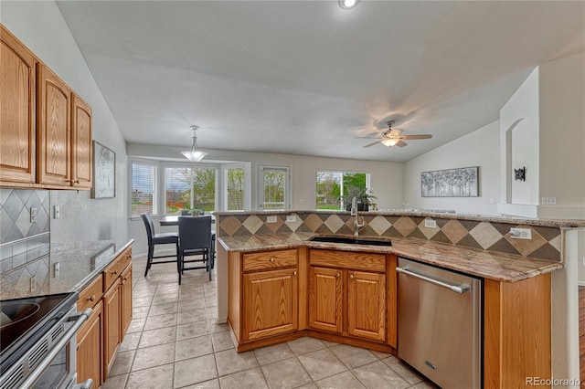 5350 S Quail Way, Littleton, CO 80127 - kitchen featuring a sink, dishwasher, tasteful backsplash, vaulted ceiling, and light stone counters