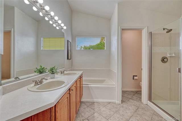 5350 S Quail Way, Littleton, CO 80127 - bathroom featuring toilet, a shower stall, vaulted ceiling, tile patterned floors, and double vanity