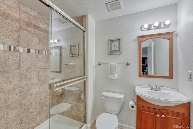 5350 S Quail Way, Littleton, CO 80127 - bathroom featuring a stall shower, toilet, vanity, and baseboards