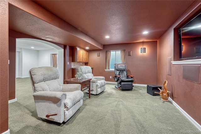 5350 S Quail Way, Littleton, CO 80127 - living area with arched walkways, carpet floors, recessed lighting, a textured wall, and baseboards
