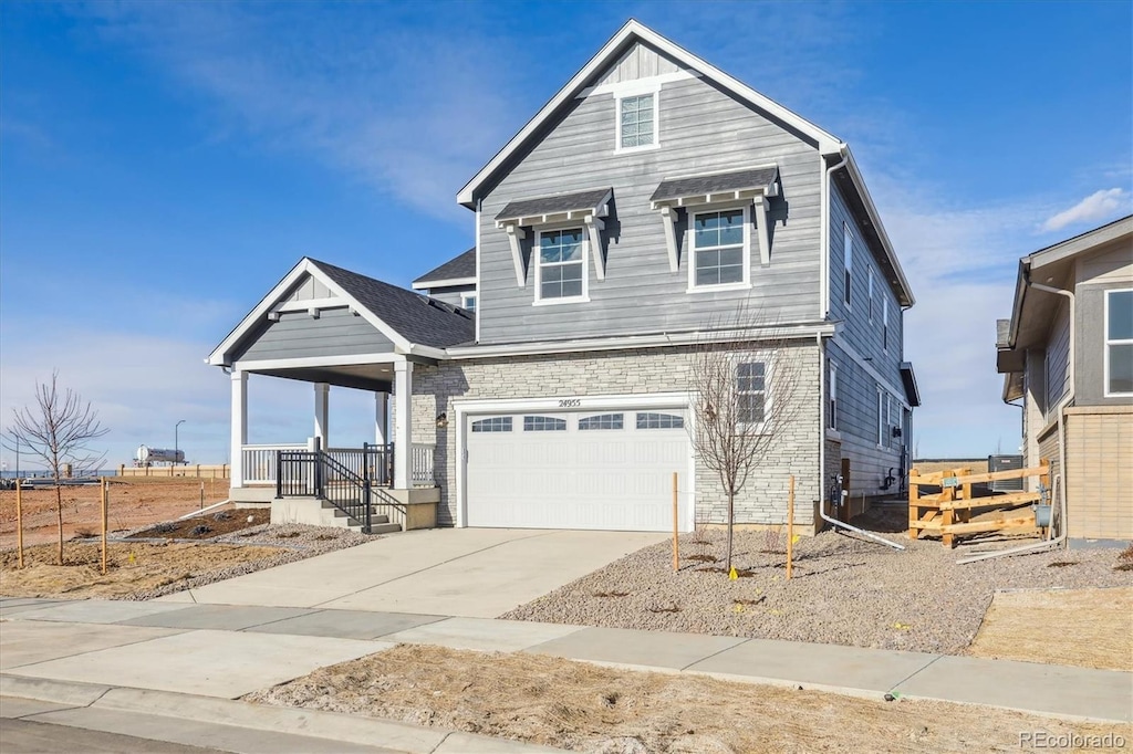 view of front of home with a garage and covered porch