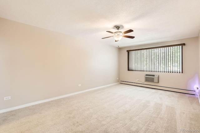 350 S Clinton St Unit 9B, Denver, CO 80247 - empty room with a ceiling fan, a baseboard radiator, light colored carpet, a wall mounted AC, and a textured ceiling