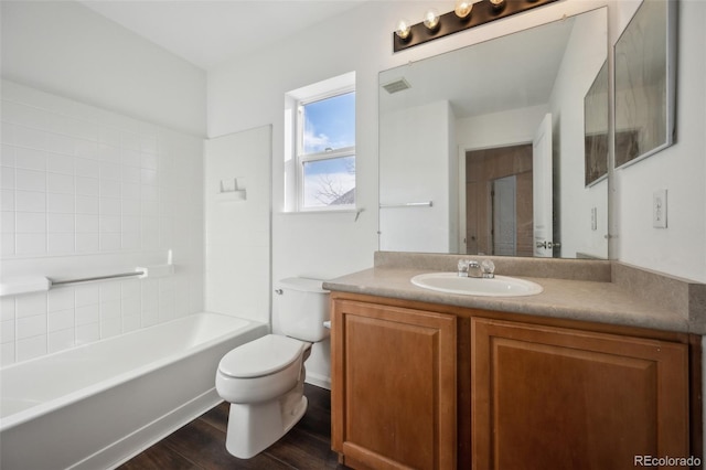 full bath with visible vents, toilet, vanity, and wood finished floors