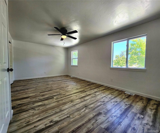 16800 E Bails Pl, Aurora, CO 80017 - spare room featuring dark wood-style flooring and a ceiling fan