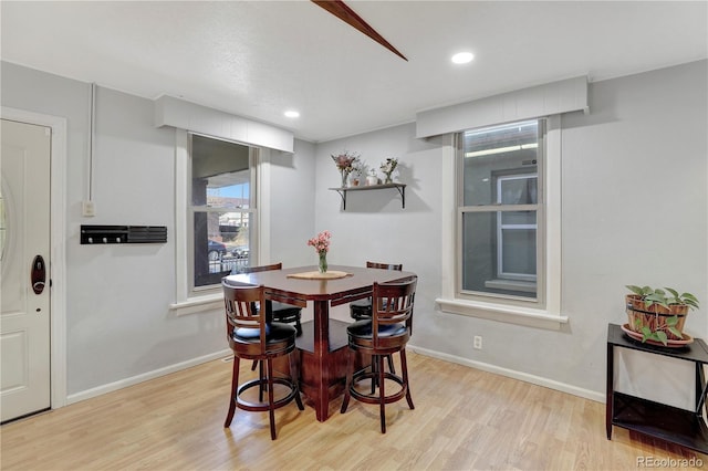 dining area featuring light wood-type flooring