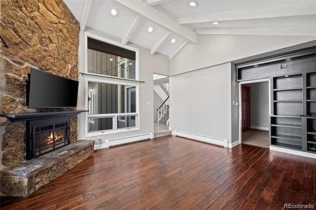 unfurnished living room with stairway, a fireplace, a baseboard heating unit, and wood finished floors