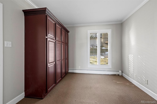 unfurnished bedroom with carpet flooring, crown molding, a baseboard heating unit, and baseboards