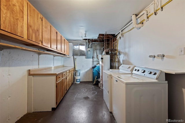 laundry room featuring electric panel, gas water heater, cabinet space, and washer and clothes dryer