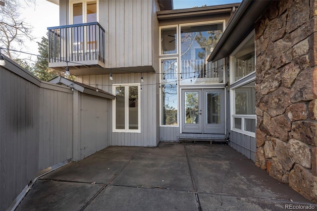 exterior space with a balcony and fence