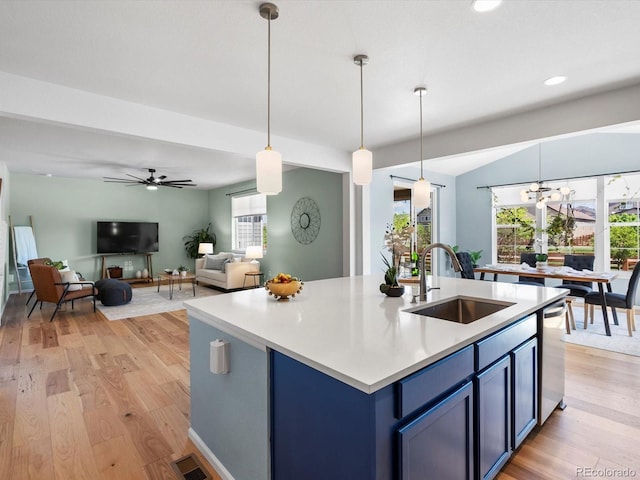 800 Boulder Peak Ave, Erie, CO 80516 - kitchen with blue cabinets, light wood-style flooring, light countertops, recessed lighting, and ceiling fan
