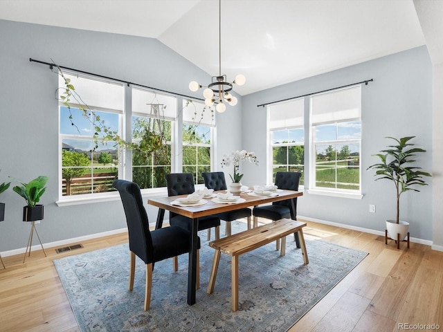 800 Boulder Peak Ave, Erie, CO 80516 - dining space featuring vaulted ceiling, a chandelier, and light wood-style flooring