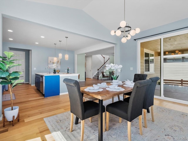800 Boulder Peak Ave, Erie, CO 80516 - dining area featuring stairway, a chandelier, light wood-style flooring, lofted ceiling, and recessed lighting