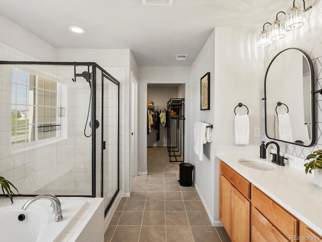 800 Boulder Peak Ave, Erie, CO 80516 - bathroom featuring a stall shower, a bath, vanity, a walk in closet, and recessed lighting