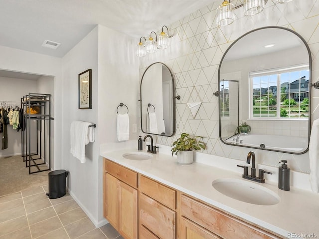 800 Boulder Peak Ave, Erie, CO 80516 - bathroom with tile patterned flooring, double vanity, and a bathtub